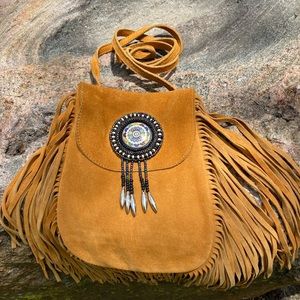 100% Suede leather bag with lots of fringe.